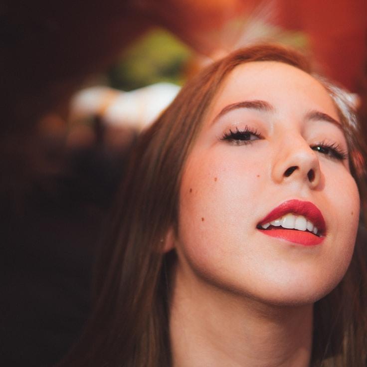 Leela Kapoor, Lead Design Curator at Mallow Haven Gather, reviewing corporate floral arrangements